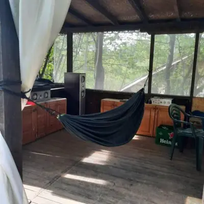 a hammock in a room with a room with a dj at 