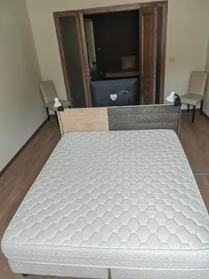 a bed in a room with a mattressvisor at Vitosha 67 in Sofia