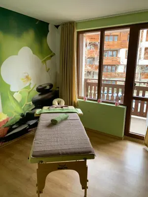 a room with a bench in front of a window at Panorama Bansko in Bansko