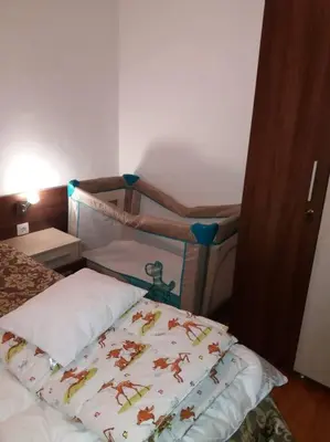 a bedroom with a bed with a pillow on it at Belvedere Holidey Clab apartament L403 in Bansko