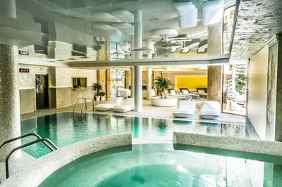 a large swimming pool in a building at Luxury Apartment 'Rich' in Velingrad