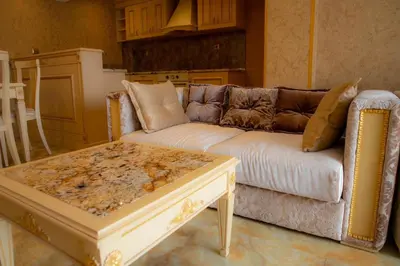 a living room with a couch and a coffee table at Luxury Apartment 'Rich' in Velingrad