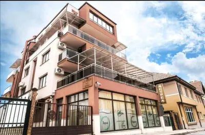 a building with a staircase on the side of it at Astrea Deluxe in Hisarya