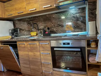 a kitchen with a sink and a stove at Златкова къща in Koprivshtitsa