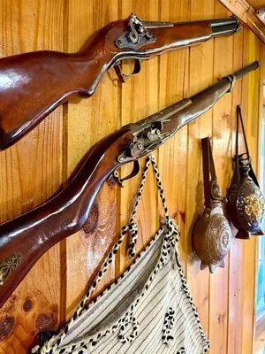 a wooden wall with a hook and a net at Златкова къща in Koprivshtitsa