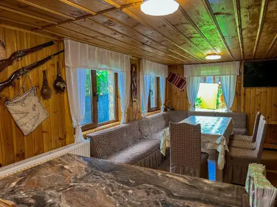 a living room with a couch and a table at Златкова къща in Koprivshtitsa