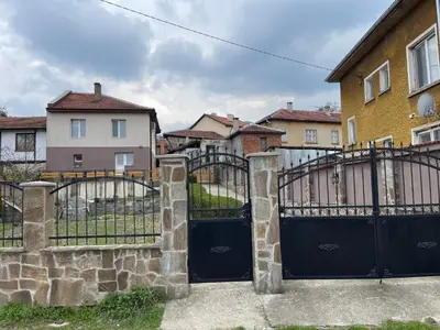 a black gate in front of a house at Еделвайс Edelvais in Kostenets Village