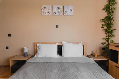 a bedroom with a large bed with two pillows at Eagles' Bridge - 1BD Flat with Desk by Flat Mаnager in Sofia