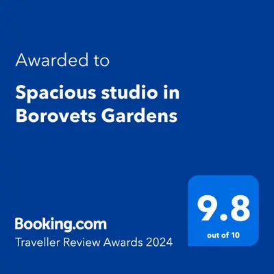 a screenshot of a phone with the text awarded to spontaneous studio in bronchoes gardens at Large studio with view in Borovets Gardens in Borovets