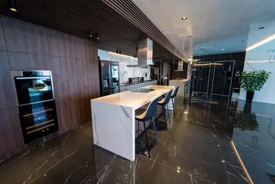a kitchen with a counter and stools in it at Sofia Paradise View Apartment in Sofia