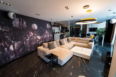 a living room with a couch and a table at Sofia Paradise View Apartment in Sofia