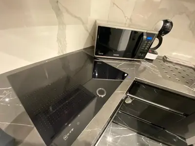 a microwave sitting on top of a counter at Sofia Paradise Lux Apartment in Sofia