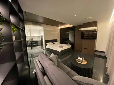 a living room with a couch and a bed at Sofia Paradise Lux Apartment in Sofia