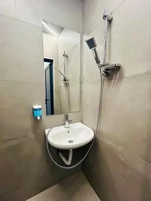 a bathroom with a sink and a mirror at Easy rooms in Sofia