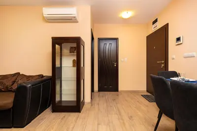 a living room with a couch and a door at South Plovdiv - 2BD Flat with Balcony by Flat Mаnager in Plovdiv