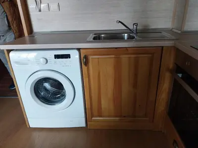 a kitchen with a sink and a washing machine at Piringolf apartment in Razlog