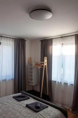 a bedroom with a bed with a cross on it at Green Villa in Saparewo