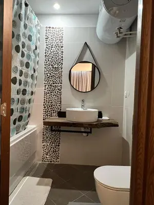 a bathroom with a sink and a mirror on the wall at Аpartment B201 Grand Bansko 1 in Bansko