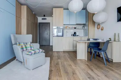 a kitchen with a table and a chair and a table at New Studio - 300m Subway - 10 Mins City Centre in Sofia
