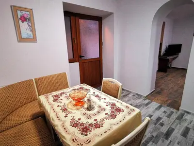 a table in a room with a table cloth on it at Студио за гости - Лили in Ognyanovo