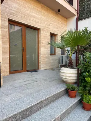 a front door of a house with a potted plant at Odrys Apartments in Plovdiv