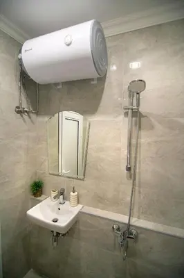 a bathroom with a sink and a shower at Odrys Apartments in Plovdiv
