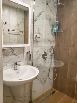 a bathroom with a sink and a shower at Studio A10 Borovets gardens in Borovets