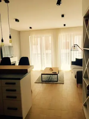 a living room with a couch and a table at 2 BED APARTMENT IN BANSKO RESORT in Bansko