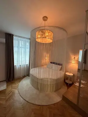 a living room with a bed in a large room at Luxury apartment with Jacuzzi in Sofia