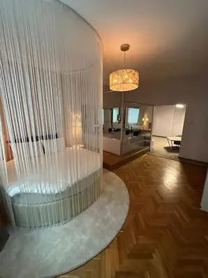 a living room with a large glass wall at Luxury apartment with Jacuzzi in Sofia
