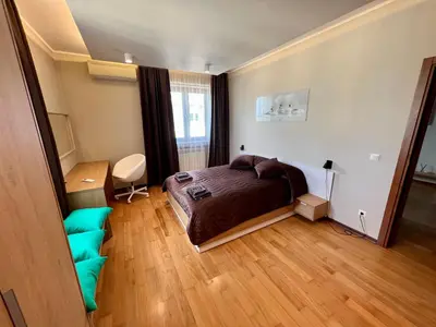a bedroom with a bed and a wooden floor at LOCATION ! LOCATION ! LOCATION ! City Garden View Oak apartment in Sofia