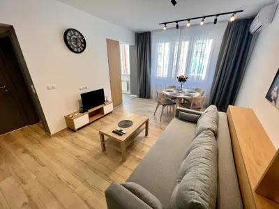 a living room with a couch and a table at LOCATION ! Sofia Opera View Apartment next to ALEXANDER NEVSKY CATHEDRAL in Sofia