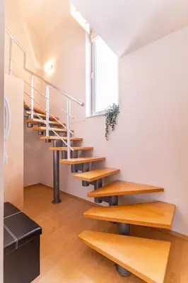 a staircase in a room with a window at Spacious apartment in the city center in Plovdiv
