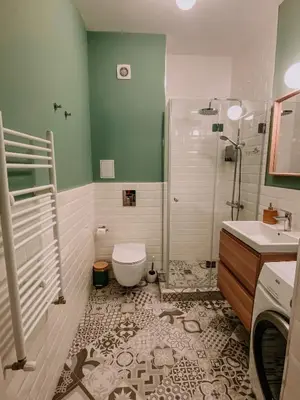 a bathroom with a shower and a toilet and a sink at Vitosha View Apartment & Free Parking in Sofia