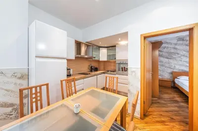a kitchen with a dining table in a room at Sofia University Life Apartment in Sofia