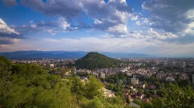 a view of a city with a hill at Къща Бети самостоятелни апартаменти с двор край Пловдив in Skutare