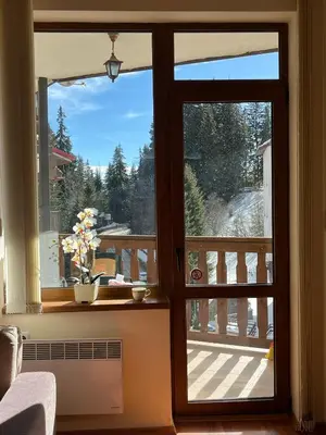 an open door with a view of a balcony at Cedar Heights 2 in Pamporovo