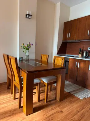 a dining room table and chairs in a kitchen at Cedar Heights 2 in Pamporovo