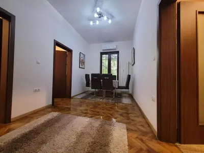 an empty living room with chairs and a table at Luxury apartment Sofia top centre in Sofia