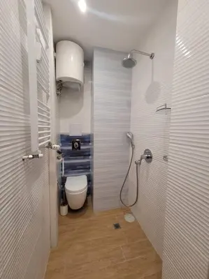 a bathroom with a shower and a toilet in it at Luxury apartment Sofia top centre in Sofia