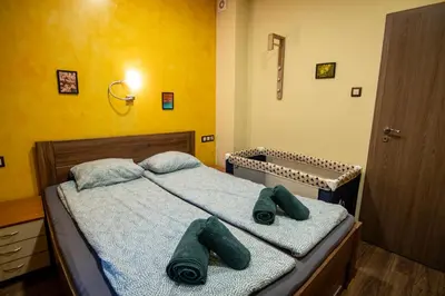 a bedroom with two beds with towels on them at Comfort & Cozy Apartment in Sofia Center in Sofia