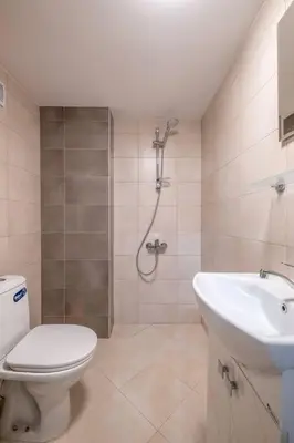a bathroom with a shower and a toilet and a sink at Gorgeous 2 BDRM fully equipped flat, TOP location in Sofia
