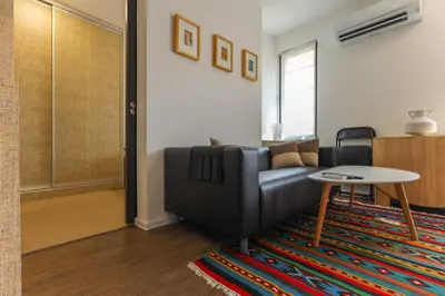 a living room with a couch and a table at Old Town View in Plovdiv