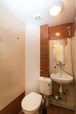a bathroom with a toilet and a sink at Charming Artistic Central Apartment in Sofia