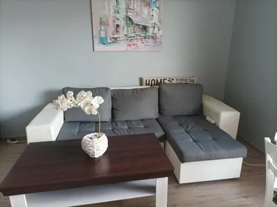 a living room with a couch and a table at One Bedroom Apartment 61 - Restaurant Stadium Plovdiv in Plovdiv