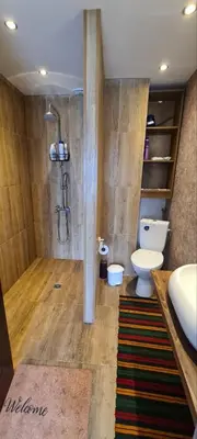 a bathroom with a shower and a toilet and a sink at стаи за гости Никол in Starosel