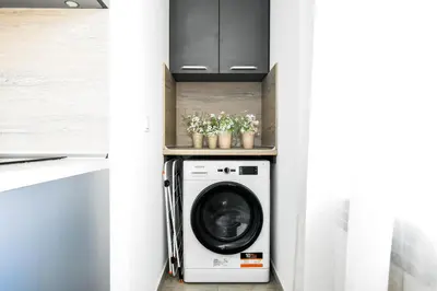 a laundry room with a washer and dryer at Budget Stay Near Sofias Lions Bridge in Sofia