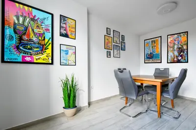a dining room with a table and chairs at Budget Stay Near Sofias Lions Bridge in Sofia