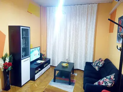 a living room with a couch and a television at 