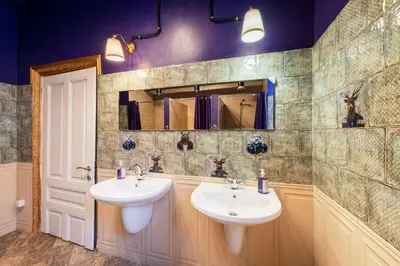 a bathroom with two sinks and a mirror at The Green Bar House in Sofia